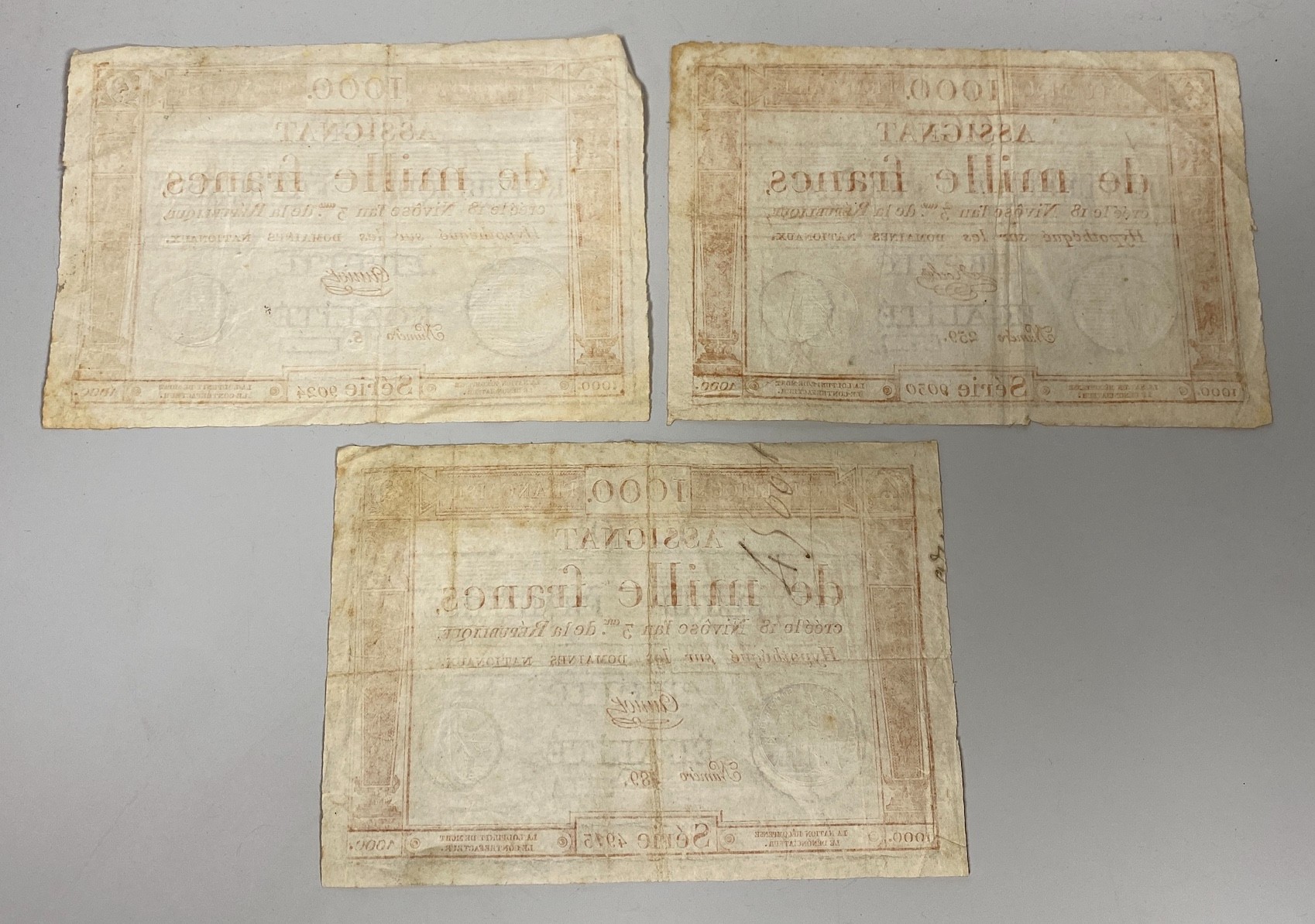 French Revolutionary banknotes, Republic Francaise, three Assignat de mille francs 1000 Francs 18 Nivose An III - 1795, Serie 9024, Numero 8, Serie 9030, Numero 259 and Serie 4913, Numero 489, watermarks (3)
